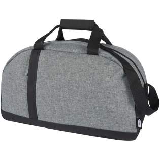 Le sac de voyage et de sport Reclaim bicolore recyclé GRS est fabriqué à partir de matériaux 100 % recyclés à l'extérieur et dispose d'une poche avant zippée verticale et d'un compartiment principal spacieux zippé. Poignées de transport et bretelles réglables pour votre confort de transport, ce qui le rend adapté aux activités sportives.