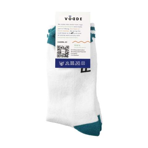 Comfortable socks from Vodde made using a 100% circular economy manufacturing process. These socks are made from collected textiles. The socks consist of 53% recycled cotton (from collected pieces of fabric), 38% recycled polyester (from collected PET bottles), 6% nylon and 3% elastane. Including knitted-in, customised design. All Vodde socks are supplied as standard in pairs with a label, which can be printed in your own full color design. This way you can design your own socks that perfectly match any corporate identity. These quality socks have a reinforced sole and are ideal to wear during sports or hiking.   • Available in sizes M (36-40) and L (41-46). • Minimum order: 100 pairs of socks per size. Minimum order in total: 200 pairs of socks.  • Optional:  Supplied in pairs in a (customised) box made from recycled  cardboard - possible from 1,200 pairs of socks.   • By wearing these socks you are contributing to a sustainable world with less pollution. Developed and tested in the Netherlands. Made in the EU.  • The Dutch company Vodde reuses discarded textiles to make new products designed by Dutch designers. Vodde makes its yarn from cotton collected by local 'rag farmers' and from cutting waste from textile production in European countries where Vodde makes its own products. In addition, polyesters derived from PET bottles, nylon, fishing nets and other collected waste are also used.