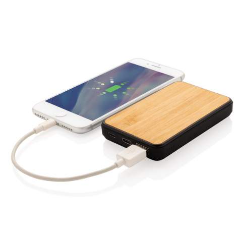 5.000 mAh pocket powerbank made with RCS (Recycled Claim Standard) certified recycled ABS material with soft touch finish and FSC® certified bamboo.  Total recycled content: 20 % based on total item weight. RCS certification ensures a completely certified supply chain of the recycled materials. When fully charged it will provide you with enough energy to re-charge your mobile phone up to three times. The powerbank contains a long-lasting grade A 5.000 mAh high density lithium polymer battery. The power indicators will indicate the remaining energy level so you always know when to re-charge. Type-C input 5V/2A Micro USB Input 5V/2A. Output 5V/2A. Packed in FSC® mix packaging. Including RCS certified recycled TPE charging cable<br /><br />PowerbankCapacity: 5000<br />PVC free: true