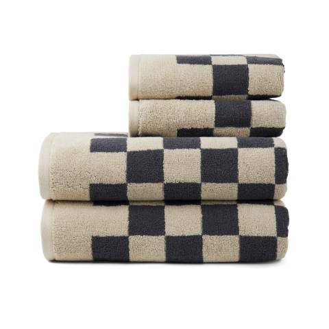 Experience the perfect blend of style, comfort, and absorbency with these exquisite towels. This set offers exceptional softness and functionality. With a plush 500 gsm weight, these towels offer good absorbency and softness. The modern checkerboard pattern adds sophistication to your bathroom decor. The set includes two towels measuring (135x165cm) and two smaller, practical towels measuring (65x40cm). Each set is thoughtfully packaged in FSC®-certified kraft packaging. The Organic Content Standard (OCS) verifies organically grown material and tracks it from source to final product. This product contains 99% OCS certified organic cotton.