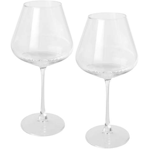 Elevate your wine-drinking experience with this exquisite set of 2 wine glasses, each boasting a generous volume capacity of 680 ml. Designed with the connoisseur in mind, these glasses combine both elegance and functionality, making them perfect for savouring your favourite wines.
