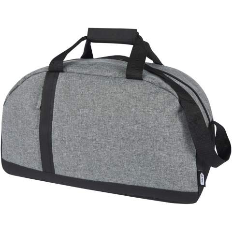 The Reclaim GRS recycled two-tone sport duffel bag is made from 100% recycled materials on the exterior, and it features a vertical zippered front pocket and a roomy zippered main compartment. Webbing wrapped carry handles and adjustable shoulder straps for your carrying comfort, making it suitable for sport activities.  