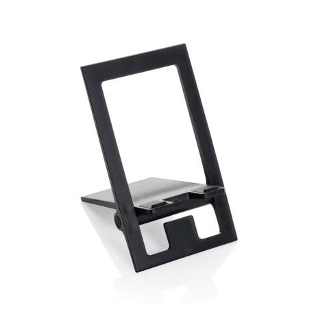 Flat and foldable phone stand made from RCS recycled ABS.  The stand comes flat and folded and can be unfolded into a phone stand that can carry all size phones. The stand is strong enough to adjust the viewing angle. With silicon cushioning to keep your phone in optimal condition. Total recycled content: 85% based on total item weight. RCS certification ensures a completely certified supply chain of the recycled materials. Packed in FSC® packaging. PVC Free.