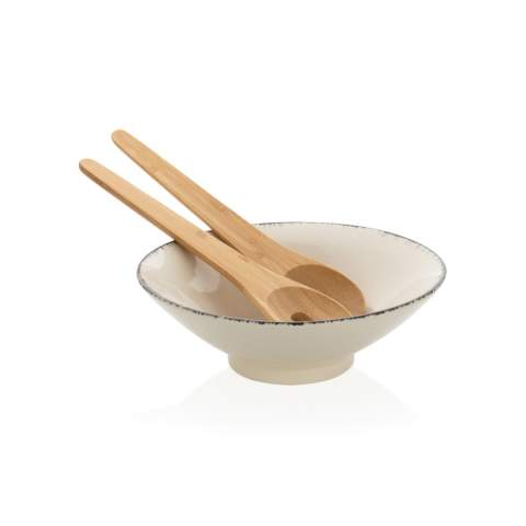 This beautiful Ukiyo salad bowl is ideal for salads or other bigger dishes. The bowl is made of ceramic and has a black detailed edge, which gives it an exciting and rustic look that is extremely suitable for a modern home. The bowl comes with bamboo salad cutlery which makes the set complete. The bowl is both dishwasher and microwave safe. Including kraft gift box. Dimensions: dia 25.5cm.