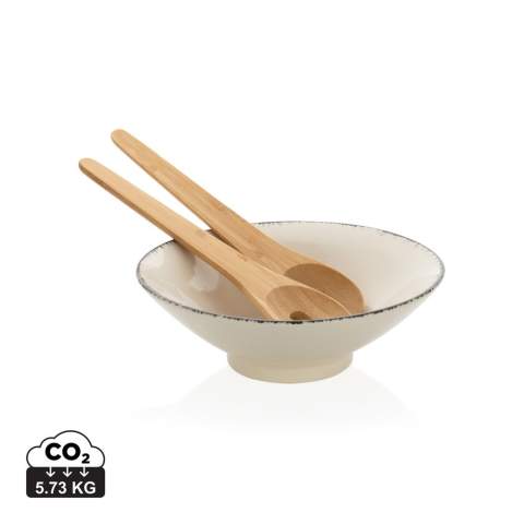 This beautiful Ukiyo salad bowl is ideal for salads or other bigger dishes. The bowl is made of ceramic and has a black detailed edge, which gives it an exciting and rustic look that is extremely suitable for a modern home. The bowl comes with bamboo salad cutlery which makes the set complete. The bowl is both dishwasher and microwave safe. Including kraft gift box. Dimensions: dia 25.5cm.