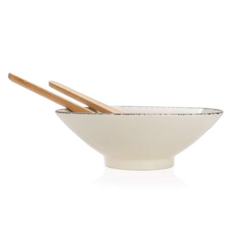 This beautiful Ukiyo salad bowl is ideal for salads or other bigger dishes. The bowl is made of ceramic and has a black detailed edge, which gives it an exciting and rustic look that is extremely suitable for a modern home. The bowl comes with bamboo salad cutlery which makes the set complete. The bowl is both dishwasher and microwave safe. Including kraft gift box. Dimensions: dia 25.5cm.