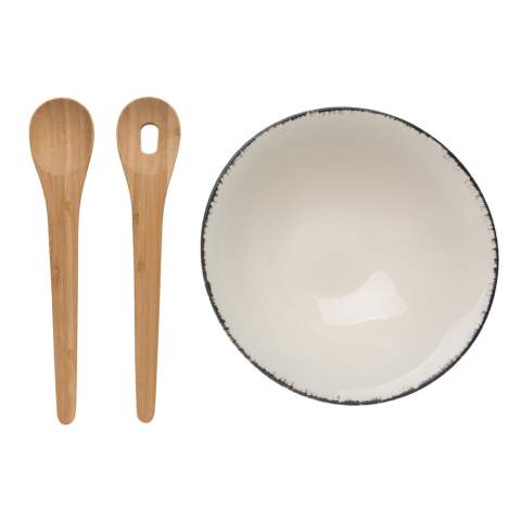 This beautiful Ukiyo salad bowl is ideal for salads or other bigger dishes. The bowl is made of ceramic and has a black detailed edge, which gives it an exciting and rustic look that is extremely suitable for a modern home. The bowl comes with bamboo salad cutlery which makes the set complete. The bowl is both dishwasher and microwave safe. Including kraft gift box. Dimensions: dia 25.5cm.