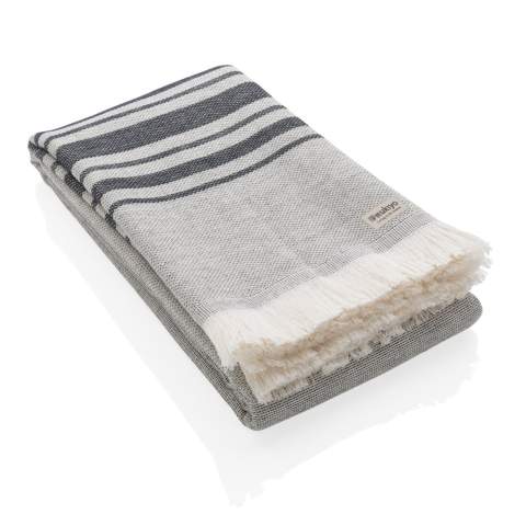 This lightweight, highly absorbent, sand-resistant, and quick dry towel is one of the best sustainable towels out there. Hammam towels are multifunctional: you can also use it as a picnic, baby blanket or as a yoga, beach, and gym towel. Even as a table cloth. Best of all, the thin material makes it ultra-portable and easy to toss in your beach bag, suitcase or over your shoulder. This towel contains 12% recycled cotton and is super soft and silky to the touch. With AWARE™ tracer that validates the genuine use of recycled cotton. 2% of proceeds of each Impact product sold will be donated to Water.org. Made in Portugal.