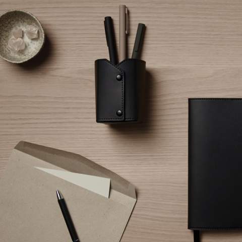 Upgrade your workspace with the Timo pen holder and experience the perfect blend of practicality and sophistication. Featuring press buttons at every corner. When the corners are buttoned together, it transforms into a convenient holder. With dimensions of L: 6 cm x W: 6 cm x H: 10 cm when folded, it's perfect for organising your desk essentials. Detail edge stitching adds a touch of refinement. Certified by RCS (Recycled Claim Standard), RSC certification guarantees that the entire supply chain of recycled materials is certified. The total recycled content is based on the overall product weight. This product contains 33% RCS certified recycled polyester.