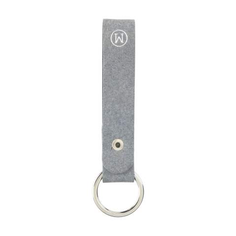 Keyring from the MADE out of brand. This keyring is made from recycled denim fibres: 70% denim waste, 25% binders and 5% vegetable additives. It has a fine, modern-looking texture. Fine fibres make this flexible material comparable to real leather. It is 100% recyclable and can be reused repeatedly. Due to the use of denim waste, mainly from the Netherlands and Germany, this product has a blue colour. Supplied with a sturdy metal keyring. A recyclable product with a contemporary look. Handmade. Dutch design. Made in Holland.