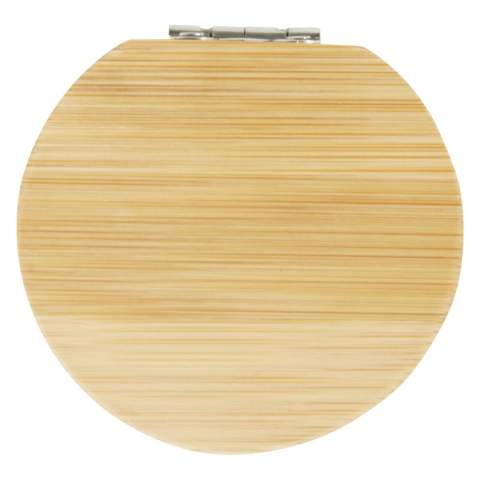 Compact pocket bamboo mirror for travel or daily skincare or makeup use. There is a small compartment at the bottom of the mirror for small accessories. The bamboo used is sourced and produced following sustainable standards.