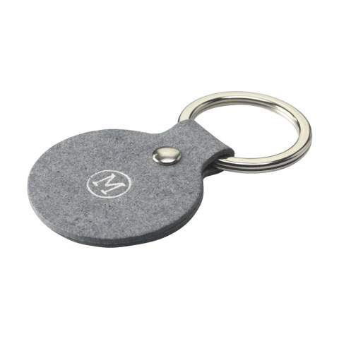 Keyring from the MADE out of brand. This keyring is made from recycled denim fibres: 70% denim waste, 25% binders and 5% vegetable additives. It has a fine, modern-looking texture. Fine fibres make this flexible material comparable to real leather. It is 100% recyclable and can be reused repeatedly. Due to the use of denim waste, mainly from the Netherlands and Germany, this product has a blue colour. Supplied with a sturdy metal keyring. A recyclable product with a contemporary look. Handmade. Dutch design. Made in Holland.