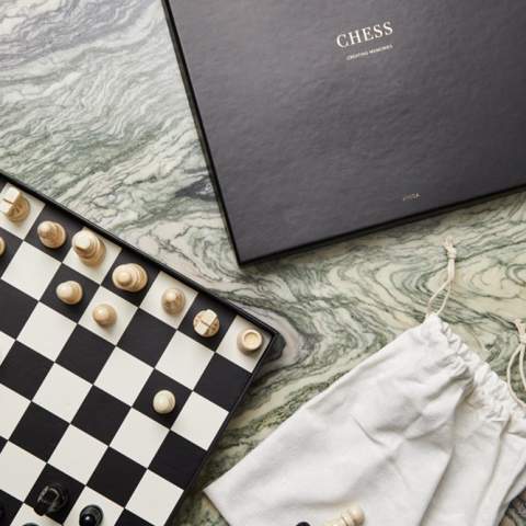 Classic chess game in black and white. The pieces are lacquered wood. The game comes with an excellent storage box that also works as an attractive decorative detail in your home.